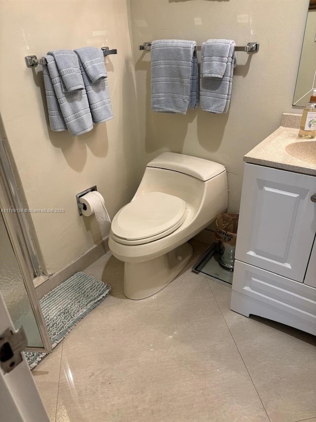 500 Three Islands Blvd Unit 313, Hallandale Beach, FL 33009 - bathroom featuring toilet, vanity, and tile patterned floors