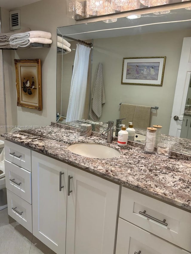 500 Three Islands Blvd Unit 313, Hallandale Beach, FL 33009 - bathroom featuring vanity, curtained shower, and tile patterned flooring