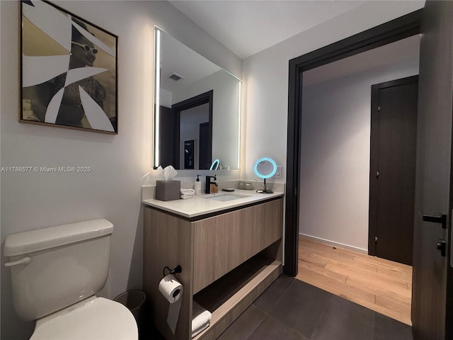 398 NE 5th St Unit 2805, Miami, FL 33132 - bathroom with toilet, vanity, and wood finished floors