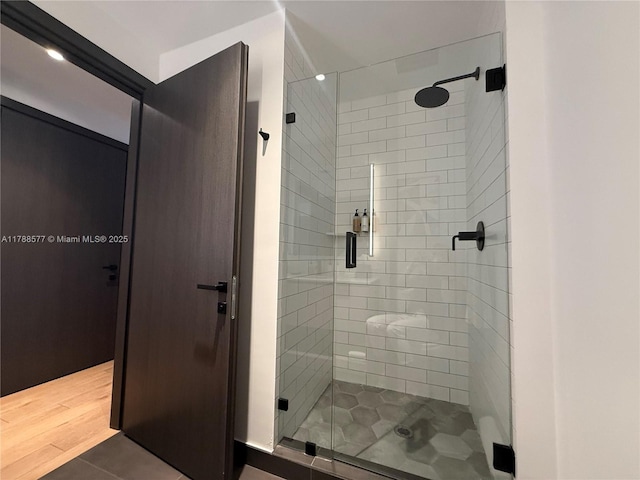 398 NE 5th St Unit 2805, Miami, FL 33132 - bathroom with a stall shower and wood finished floors