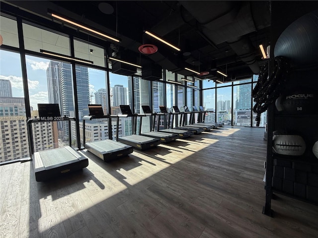 398 NE 5th St Unit 2805, Miami, FL 33132 - workout area with floor to ceiling windows and wood finished floors
