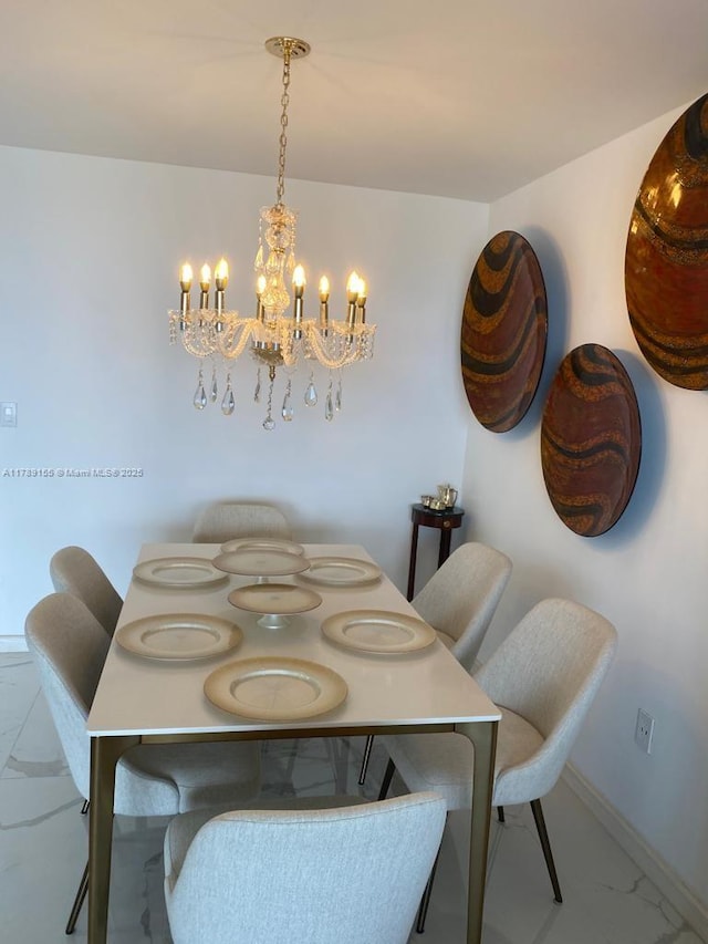 1450 Brickell Bay Dr Unit 1709, Miami, FL 33131 - dining space with baseboards, marble finish floor, and a chandelier