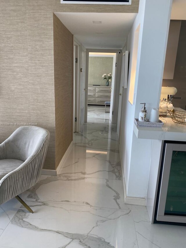1450 Brickell Bay Dr Unit 1709, Miami, FL 33131 - hall with beverage cooler, marble finish floor, and baseboards