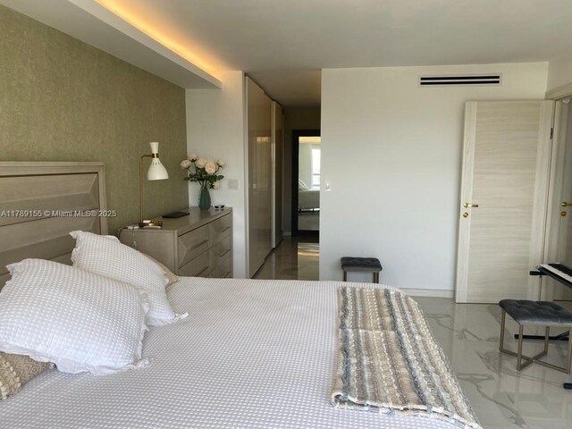 1450 Brickell Bay Dr Unit 1709, Miami, FL 33131 - bedroom featuring marble finish floor, baseboards, and visible vents