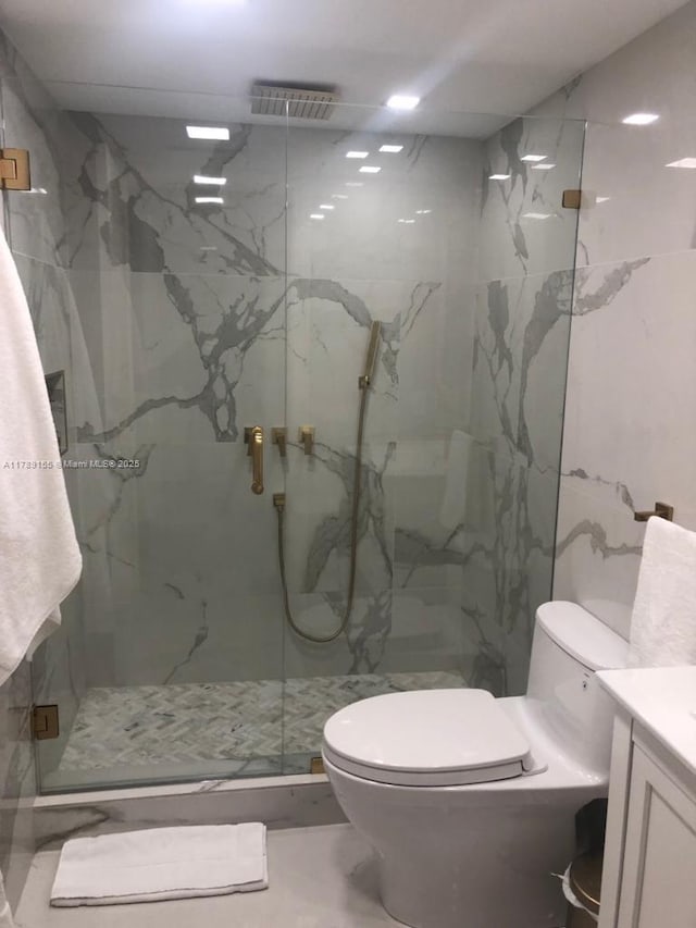1450 Brickell Bay Dr Unit 1709, Miami, FL 33131 - full bath featuring visible vents, a marble finish shower, vanity, and toilet