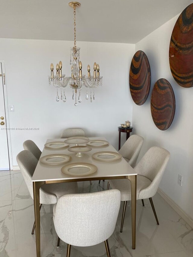 1450 Brickell Bay Dr Unit 1709, Miami, FL 33131 - dining area with marble finish floor, baseboards, and a notable chandelier