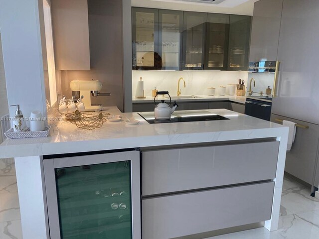 1450 Brickell Bay Dr Unit 1709, Miami, FL 33131 - bar featuring wine cooler, marble finish floor, and a sink