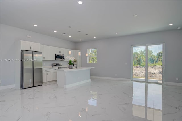 kitchen featuring baseboards, recessed lighting, and appliances with stainless steel finishes