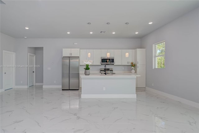 kitchen with white cabinets, recessed lighting, a center island with sink, baseboards, and appliances with stainless steel finishes