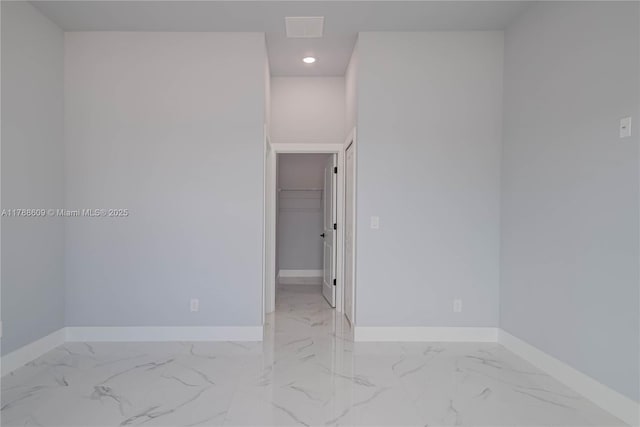 spare room with visible vents, baseboards, recessed lighting, and marble finish floor