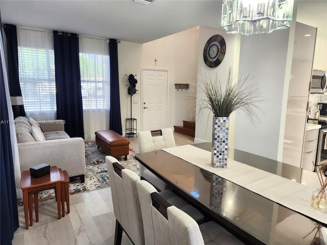 785 Falling Water Rd, Weston, FL 33326 - dining space with a notable chandelier