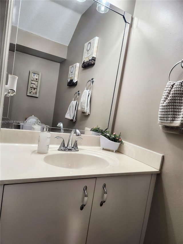 785 Falling Water Rd, Weston, FL 33326 - bathroom featuring lofted ceiling and vanity