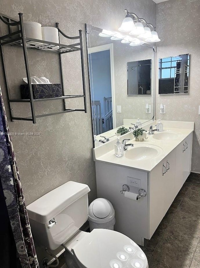 785 Falling Water Rd, Weston, FL 33326 - bathroom featuring toilet, a textured wall, and a sink