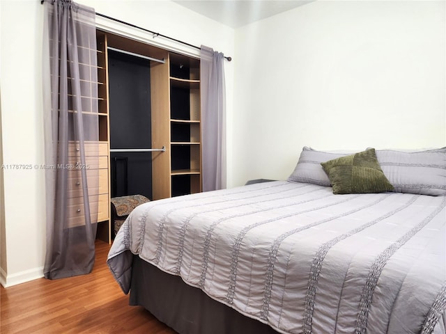 785 Falling Water Rd, Weston, FL 33326 - bedroom featuring baseboards and wood finished floors