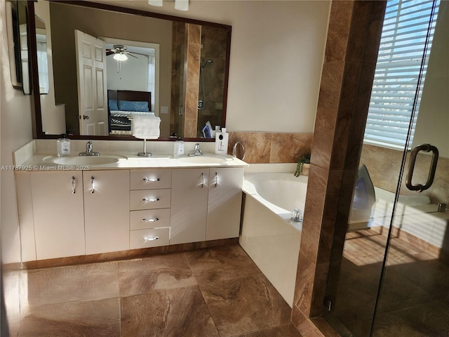 785 Falling Water Rd, Weston, FL 33326 - bathroom featuring a garden tub, a stall shower, ceiling fan, and a sink