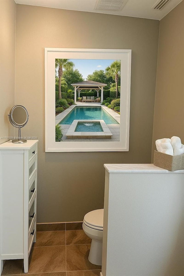 785 Falling Water Rd, Weston, FL 33326 - bathroom featuring toilet, tile patterned floors, visible vents, and baseboards
