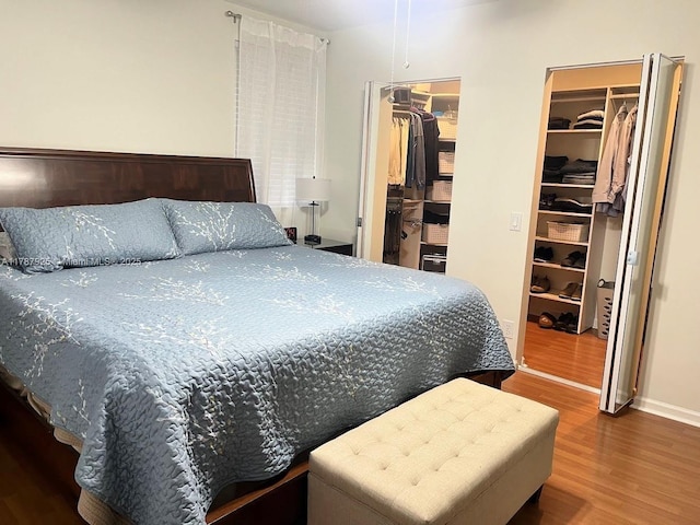 785 Falling Water Rd, Weston, FL 33326 - bedroom featuring a walk in closet, wood finished floors, and baseboards