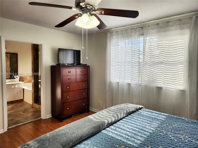 785 Falling Water Rd, Weston, FL 33326 - bedroom with wood finished floors, ensuite bath, baseboards, and ceiling fan