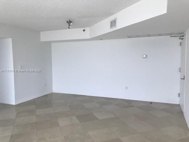 5900 Collins Ave Unit 1505, Miami Beach, FL 33140 - empty room with a textured ceiling