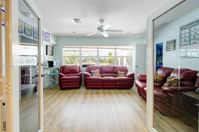 14875 SW 238th St, Homestead, FL 33032 - living room featuring wood finished floors, a ceiling fan, and french doors