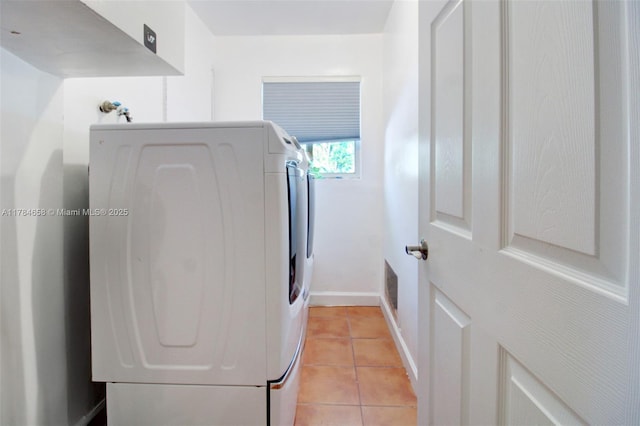 14875 SW 238th St, Homestead, FL 33032 - laundry area with washing machine and clothes dryer, light tile patterned flooring, and baseboards