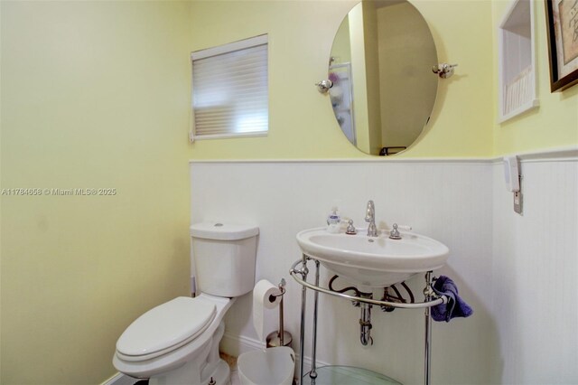 14875 SW 238th St, Homestead, FL 33032 - bathroom with toilet and wainscoting