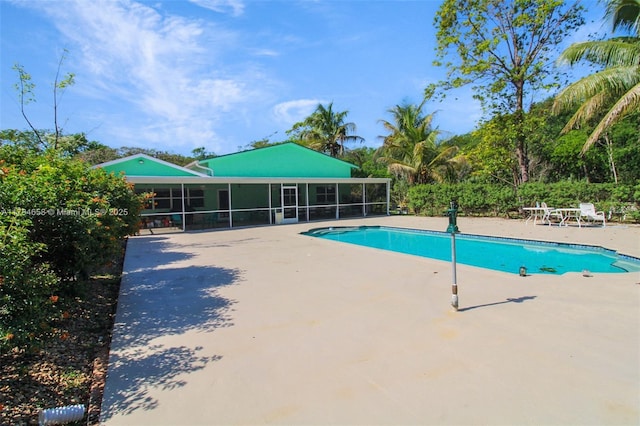 14875 SW 238th St, Homestead, FL 33032 - swimming pool featuring a sunroom and a patio area