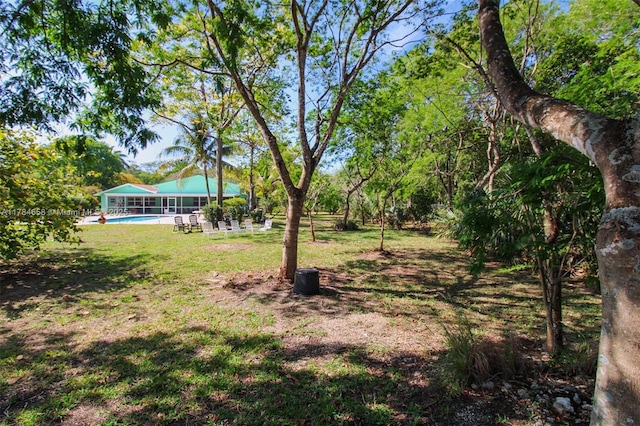 14875 SW 238th St, Homestead, FL 33032 - view of grassy yard featuring an outdoor pool