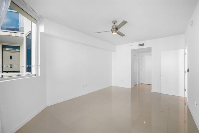 3030 NE 188th St Unit 606, Aventura, FL 33180 - tiled empty room featuring ceiling fan, visible vents, and baseboards