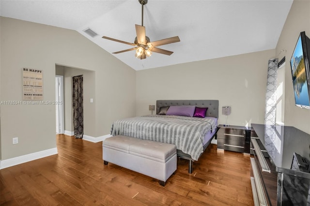 bedroom with wood finished floors, ceiling fan, baseboards, lofted ceiling, and visible vents