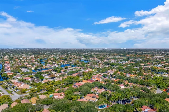 drone / aerial view with a water view and a residential view