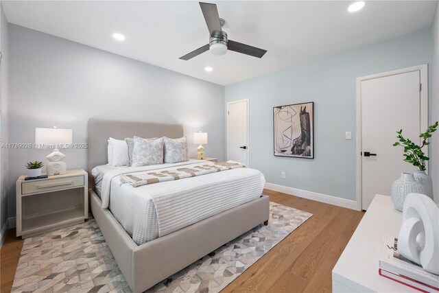 bedroom featuring recessed lighting, light wood-style floors, a ceiling fan, and baseboards