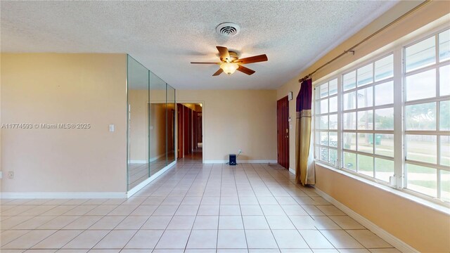 6051 SW 110th Ave, Miami, FL 33173 - empty room with a textured ceiling, ceiling fan, visible vents, and light tile patterned flooring