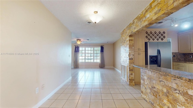 6051 SW 110th Ave, Miami, FL 33173 - interior space with baseboards, a textured ceiling, and light tile patterned flooring