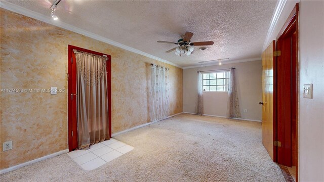 6051 SW 110th Ave, Miami, FL 33173 - carpeted empty room with ceiling fan, track lighting, a textured ceiling, baseboards, and ornamental molding