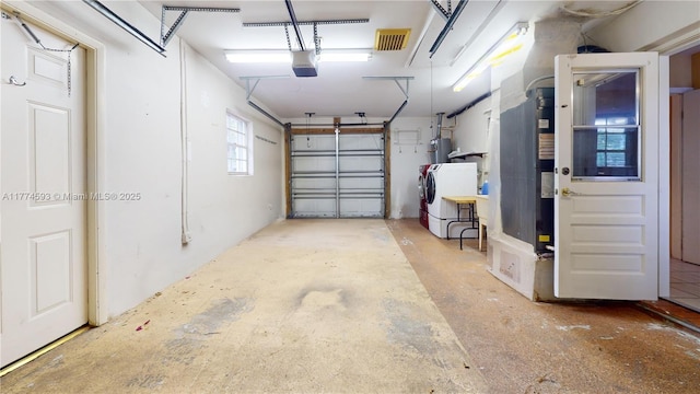 6051 SW 110th Ave, Miami, FL 33173 - garage featuring washer and dryer and a garage door opener