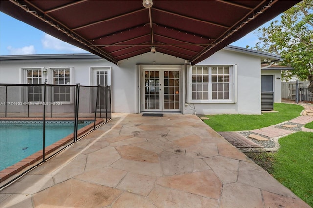 6051 SW 110th Ave, Miami, FL 33173 - rear view of property with french doors, a patio area, and stucco siding