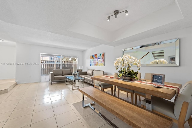 1341 NW 123rd Ter Unit 1341, Pembroke Pines, FL 33026 - tiled dining area featuring a textured ceiling and a raised ceiling