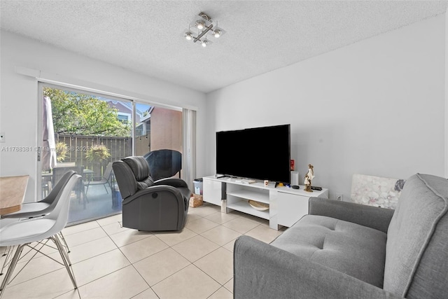 1341 NW 123rd Ter Unit 1341, Pembroke Pines, FL 33026 - living area featuring a textured ceiling and light tile patterned floors