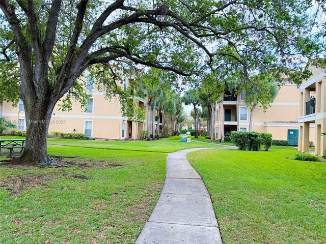805 Riverside Dr Unit 1111, Coral Springs, FL 33071 - view of community with a lawn