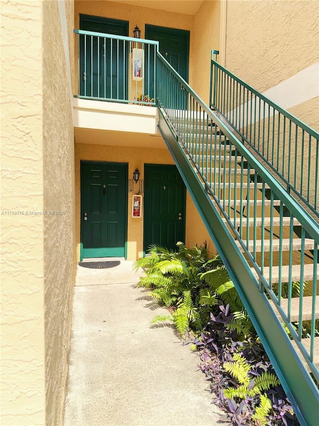 805 Riverside Dr Unit 1111, Coral Springs, FL 33071 - view of exterior entry with stucco siding