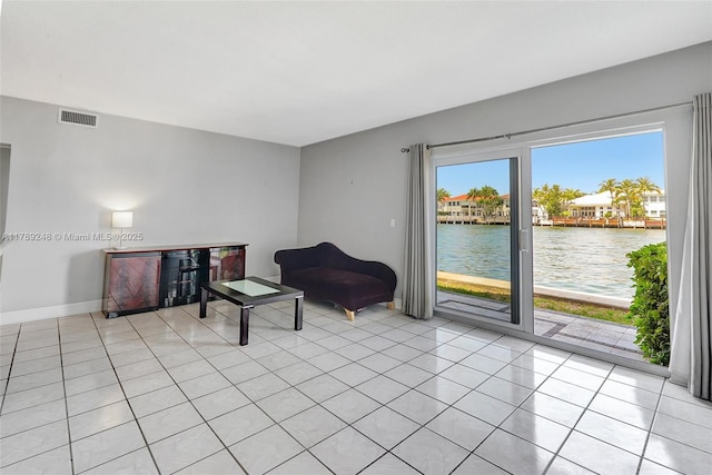 2200 S Ocean Dr Unit N116, Hollywood, FL 33019 - sitting room featuring light tile patterned floors, a water view, baseboards, and visible vents