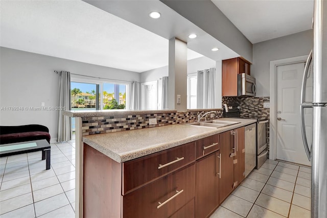 2200 S Ocean Dr Unit N116, Hollywood, FL 33019 - kitchen featuring a sink, appliances with stainless steel finishes, light tile patterned floors, and backsplash