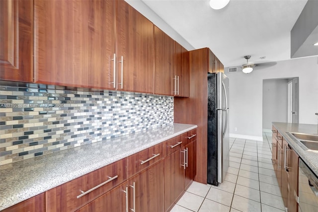 2200 S Ocean Dr Unit N116, Hollywood, FL 33019 - kitchen featuring light tile patterned flooring, appliances with stainless steel finishes, decorative backsplash, and visible vents