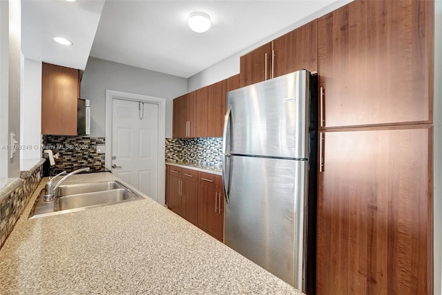 2200 S Ocean Dr Unit N116, Hollywood, FL 33019 - kitchen featuring freestanding refrigerator, a sink, backsplash, and light countertops