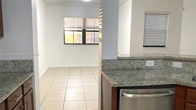 10620 NW 88th St Unit 205, Doral, FL 33178 - kitchen featuring stainless steel dishwasher, baseboards, and light tile patterned floors