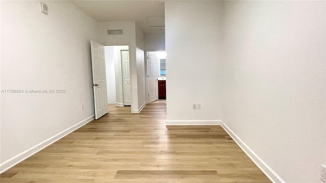 10620 NW 88th St Unit 205, Doral, FL 33178 - hallway featuring baseboards, visible vents, and light wood-style floors