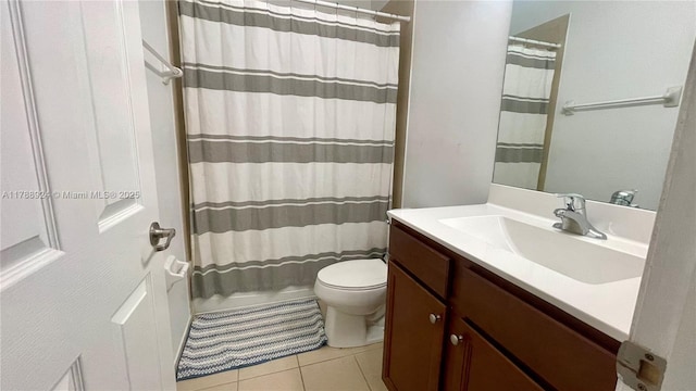 10620 NW 88th St Unit 205, Doral, FL 33178 - full bath with shower / bath combination with curtain, tile patterned floors, vanity, and toilet