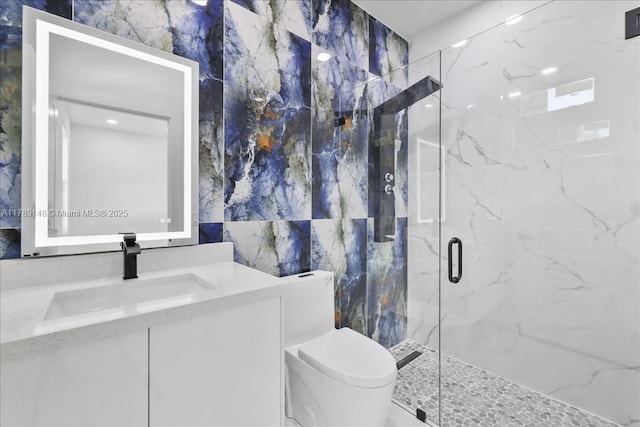 924 Berg St E, Lehigh Acres, FL 33974 - bathroom featuring tile walls, vanity, toilet, and a marble finish shower