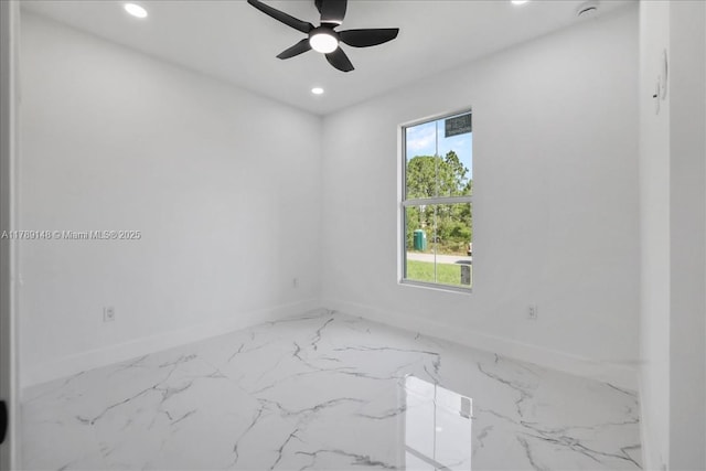 924 Berg St E, Lehigh Acres, FL 33974 - spare room with marble finish floor, a ceiling fan, recessed lighting, and baseboards